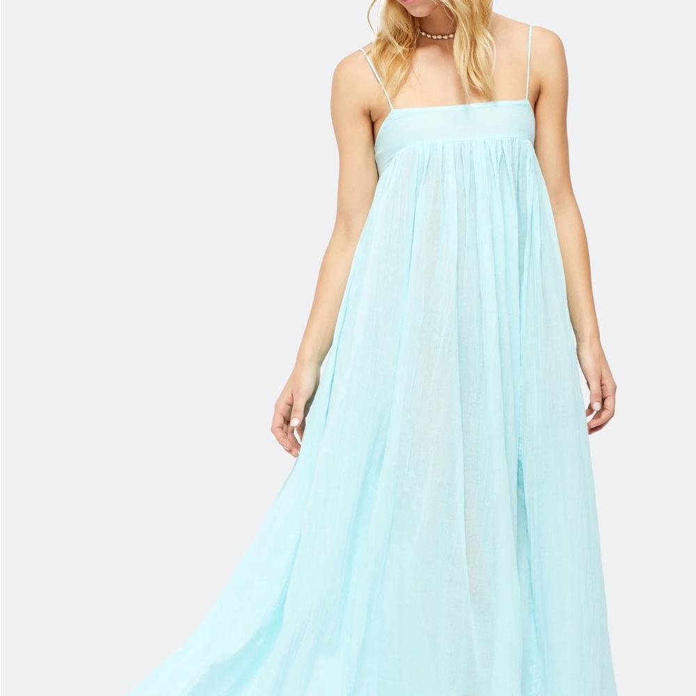 Perfect as a beach coverup or a stunning slip, this flowy maxi.